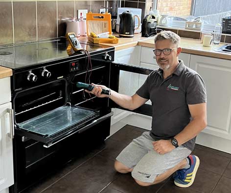 Rich repairing a cooker in Colchester